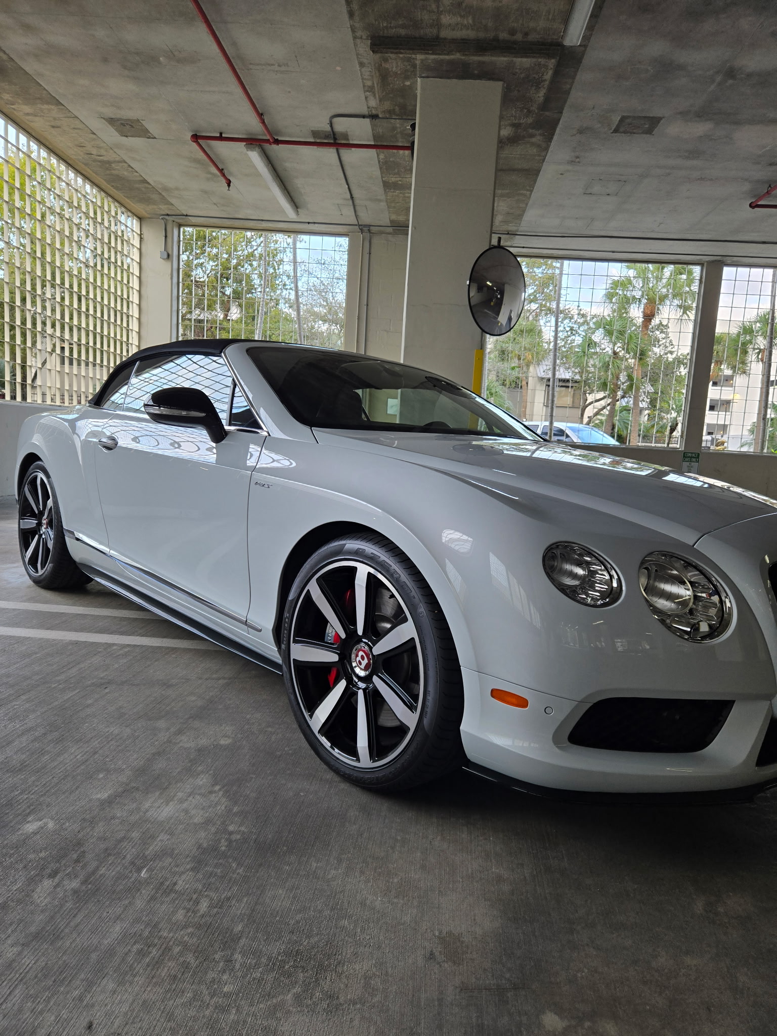 White Bentley Continental GT convertible after professional exterior detailing