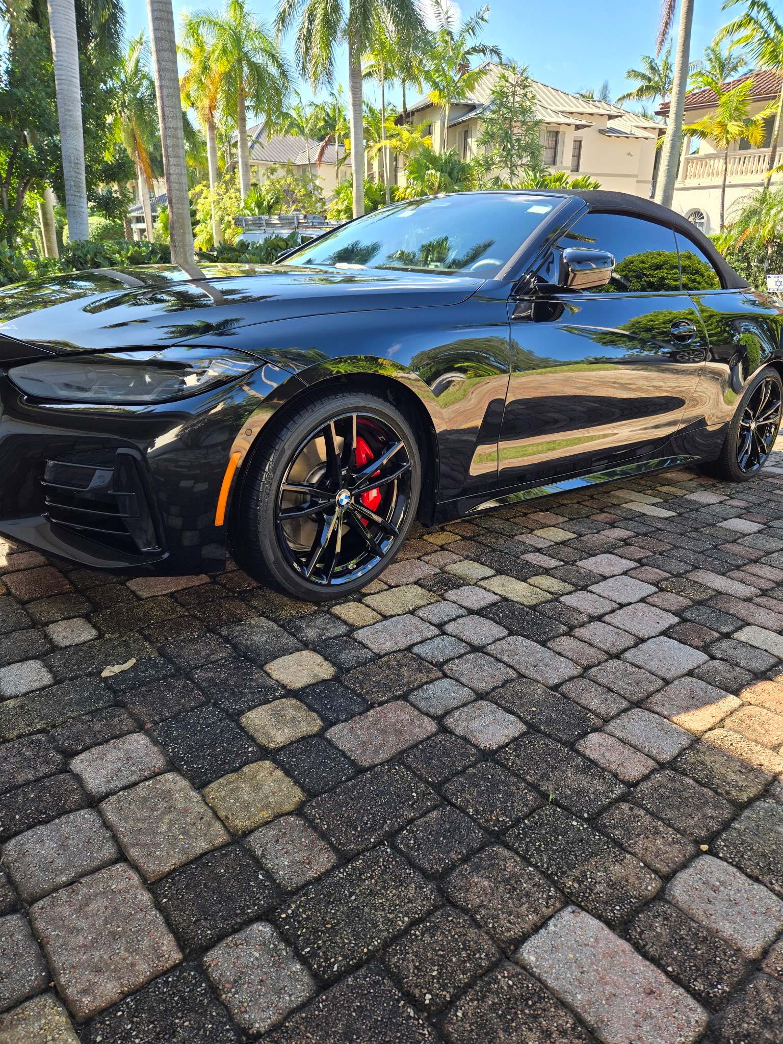 Black BMW convertible after professional exterior detailing